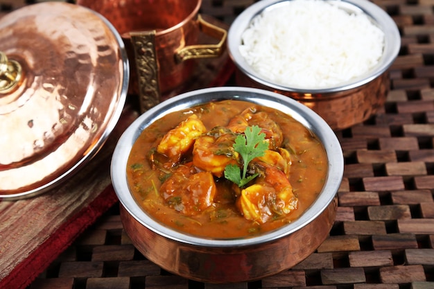 Prawns masala Kalya With Rice served in dish isolated on table side view of middle east food