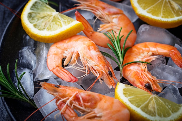 Prawns shrimps with lemon and rosemary. Selective focus