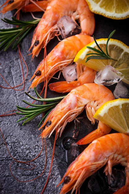 Prawns shrimps with lemon and rosemary. Selective focus