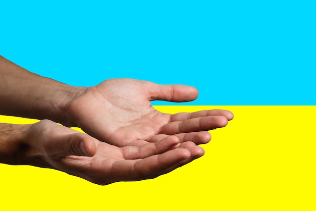 Pray for ukraine hands pray on ukraine flag