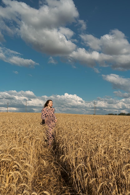 Pray for Ukraine Ukrainian girl in a wheat field A girl in a wheat field prays for peace in Ukraine Happy woman celebrating Independence Day