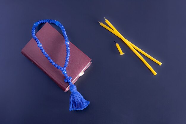 Prayer book rosary and candles