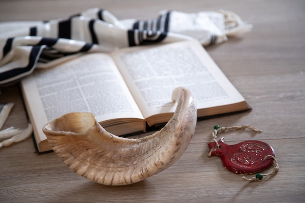 Prayer book and Shofar (horn), talit jewish religious symbols. Rosh hashanah (jewish New Year holiday)