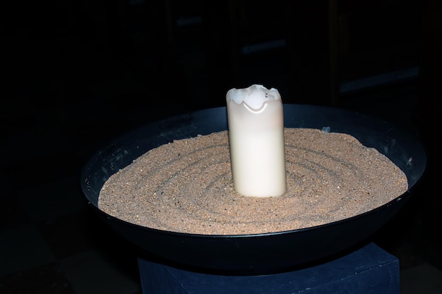 Prayer candles in votives and insence inside of a Catholic church