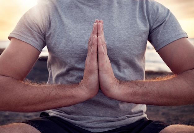 Prayer hands or praying in yoga meditation exercise or body training with peace gratitude or chakra healing energy Nature God or zen yogi relaxing in a calm lotus pose for spiritual mindfulness