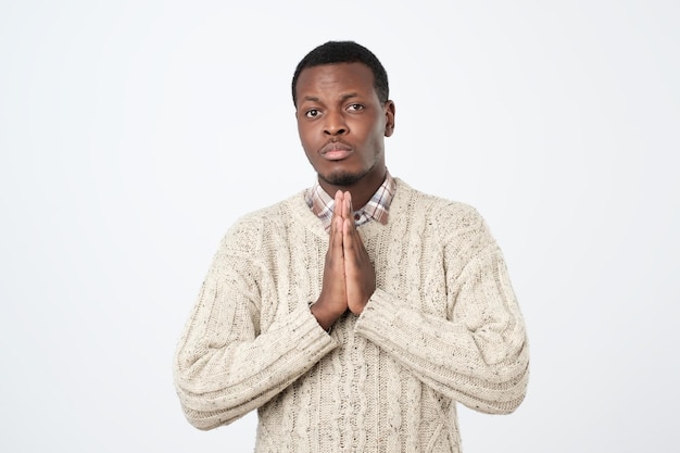 Praying african american man hoping for better