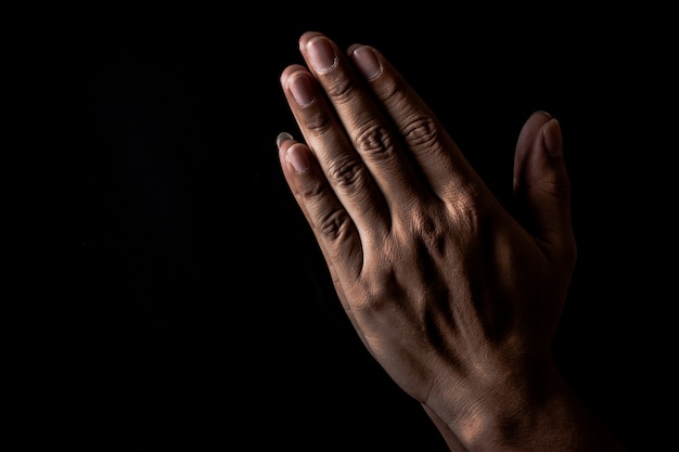 Premium Photo | Praying hand to god for fulfill one's hope on black  background, pray hand offering respect to god