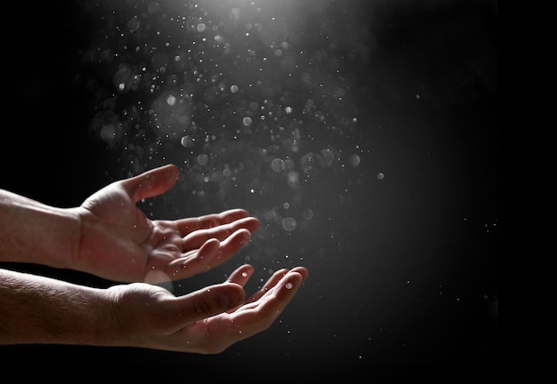 Praying human hands on dark background