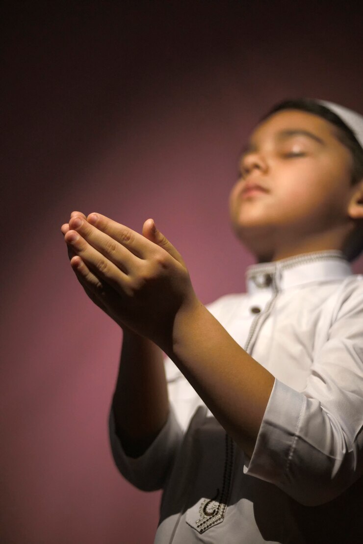 Praying muslim boy