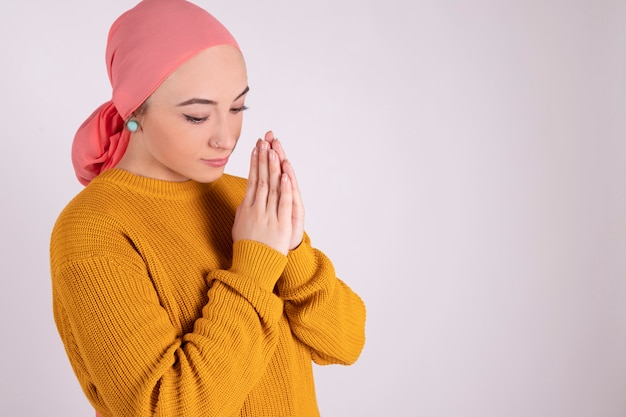 Praying woman fighting cancer