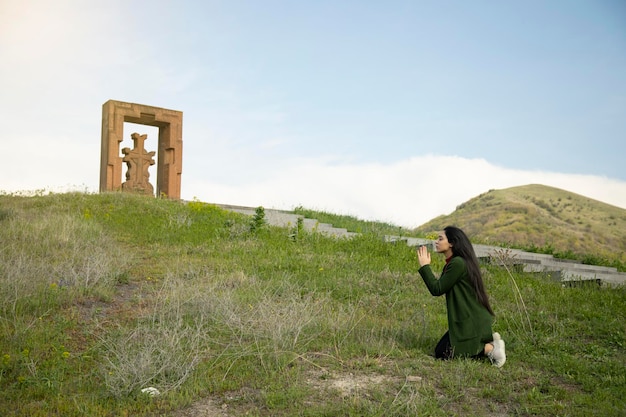 Praying woman to the ground