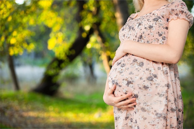 Pregant woman on natural background