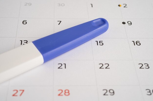 Pregnancy test on calendar contraception health and medicine