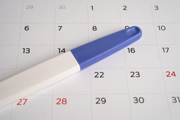 Pregnancy test on calendar contraception health and medicine