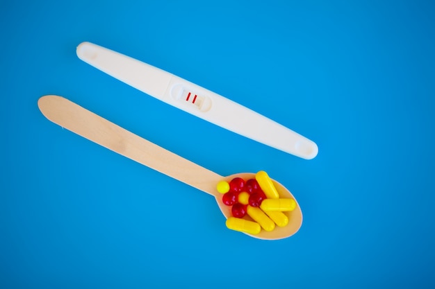 Pregnancy test. The result is positive with two strips. Treatment of infertility with pills, help in conceiving a child. Tablets from pregnancy do not work, contraception