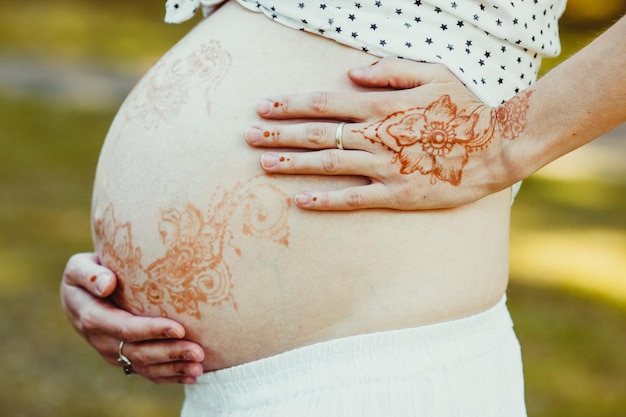 Pregnant belly painted with mehendi