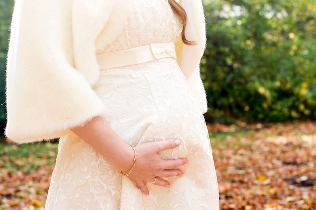 Pregnant bride on nature