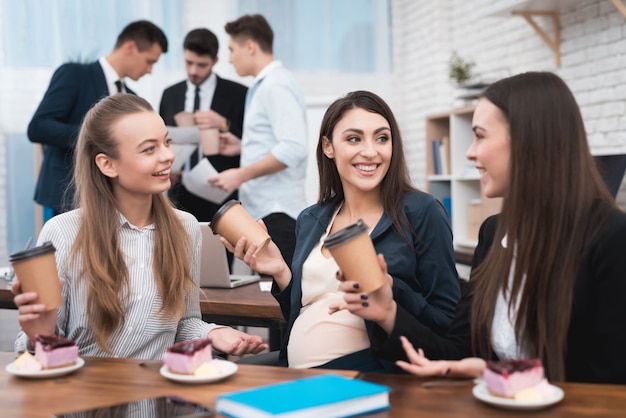 Pregnant Colleague Telling Gossips to Other Worker