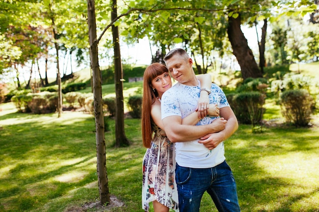 Pregnant couple in the park