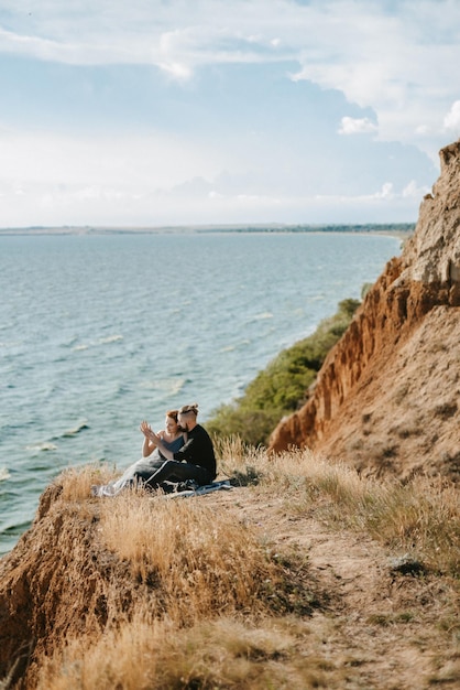 Pregnant girl and boyfriend on high hills