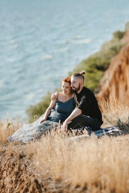 Pregnant girl and boyfriend on high hills