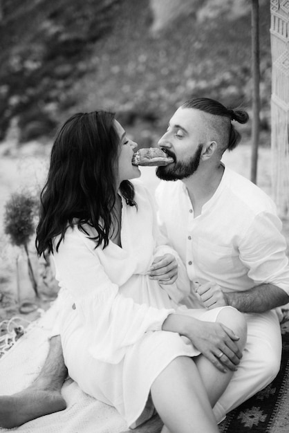 Pregnant girl and boyfriend on a picnic