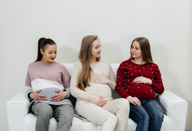 Pregnant girls are waiting for the doctor in the waiting room