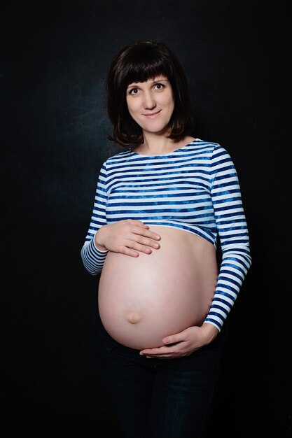 Pregnant Woman on Blackboard Background