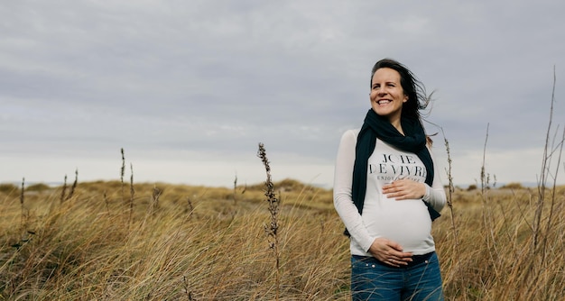 Pregnant woman caressing her tummy