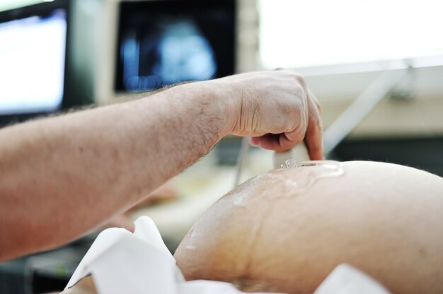 Pregnant woman checked by doctor in clinic