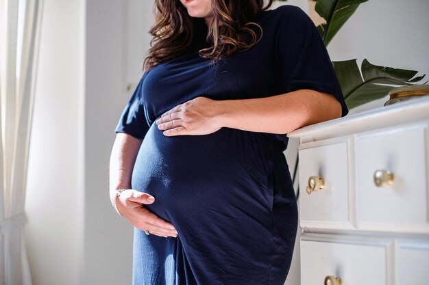 Pregnant woman close view Pregnancy background