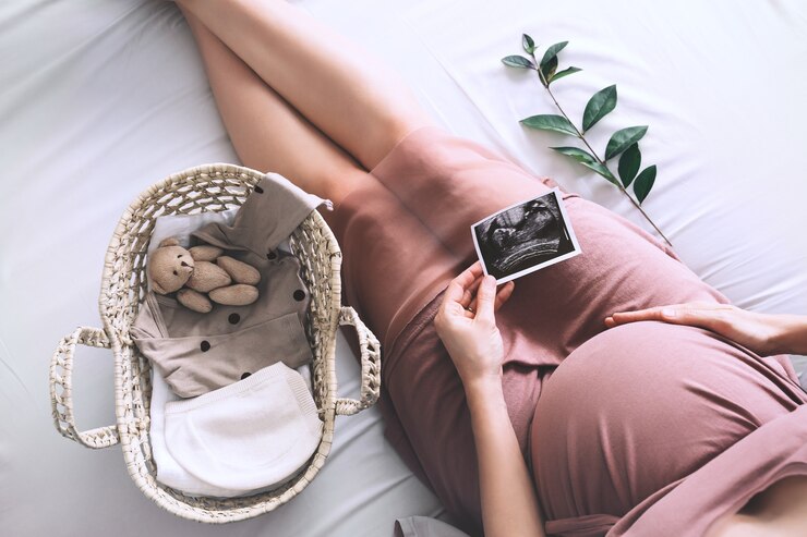 pregnant woman in dress with ultrasound image expectant mother waiting for baby birth