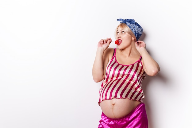 Pregnant woman eating a lollipop