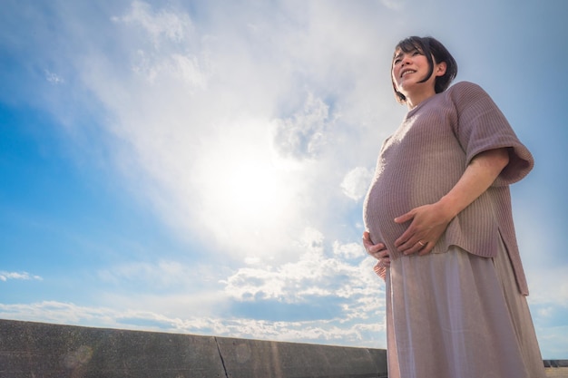 Pregnant woman and fantastic sky