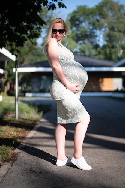 Pregnant Woman Feeling Lovely and Relax in Park