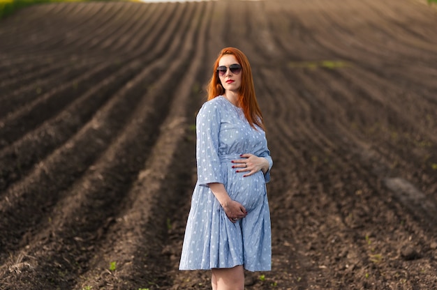 Pregnant woman on the field