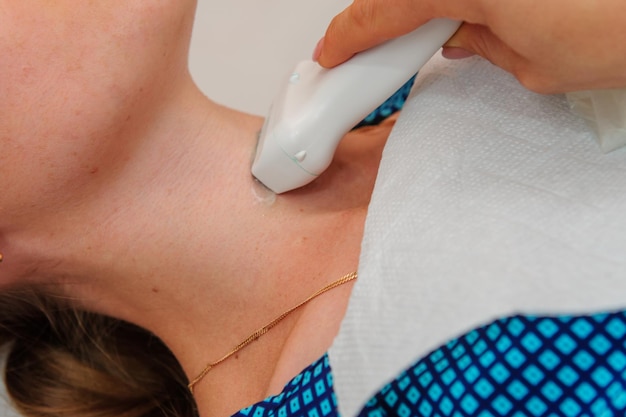 Pregnant woman getting ultrasound from doctor