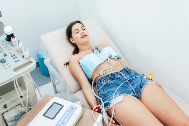 Pregnant woman getting ultrasound from doctor