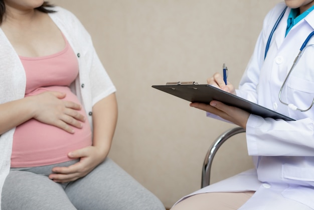 Pregnant Woman and Gynecologist Doctor at Hospital