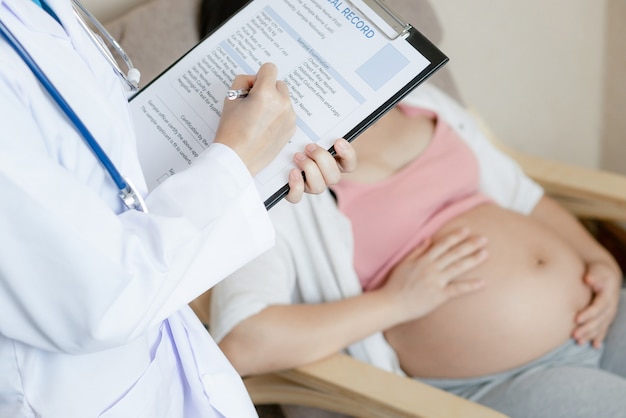 Pregnant Woman and Gynecologist Doctor at Hospital