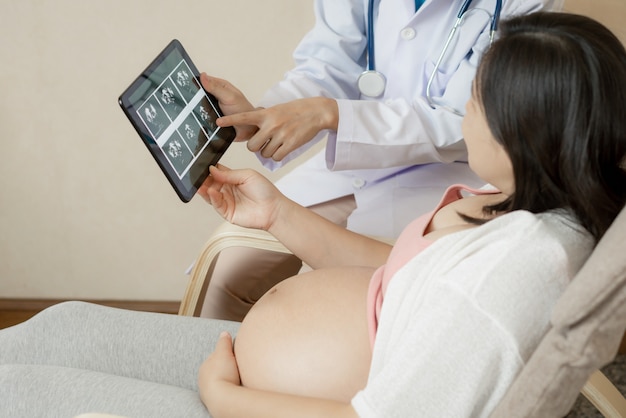 Pregnant Woman and Gynecologist Doctor at Hospital