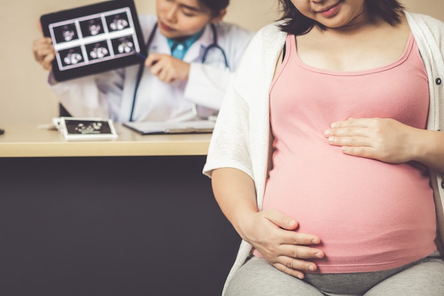 Pregnant Woman and Gynecologist Doctor at Hospital