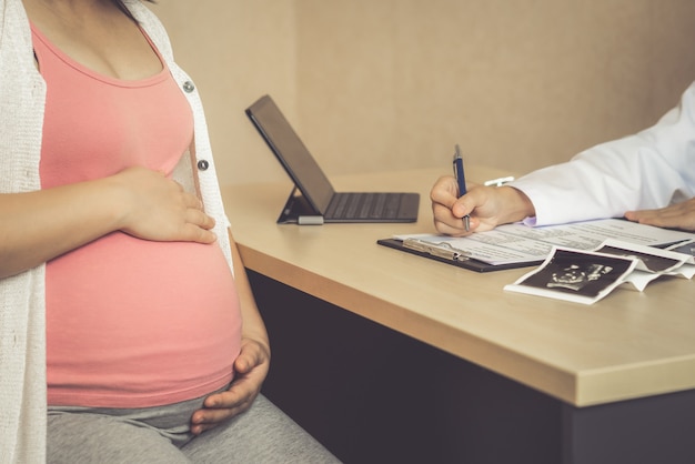 Pregnant Woman and Gynecologist Doctor at Hospital