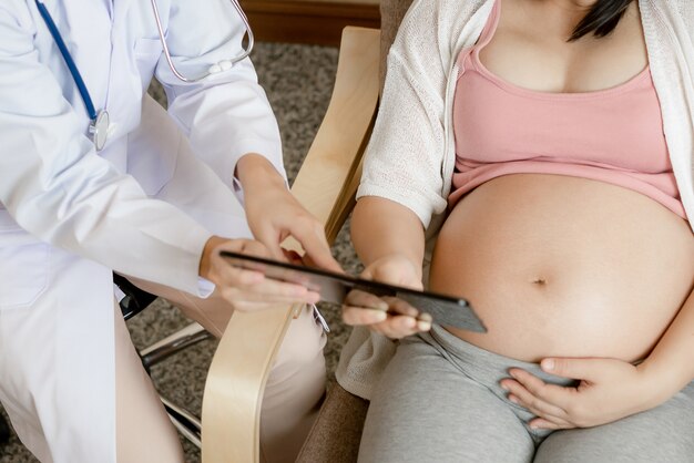 Pregnant Woman and Gynecologist Doctor at Hospital