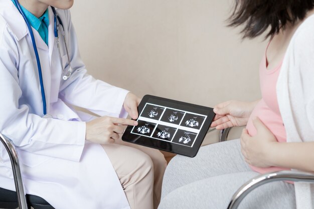 Pregnant Woman and Gynecologist Doctor at Hospital