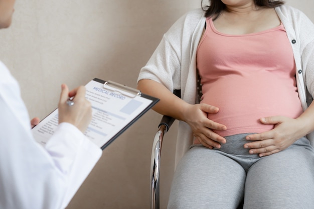 Pregnant Woman and Gynecologist Doctor at Hospital