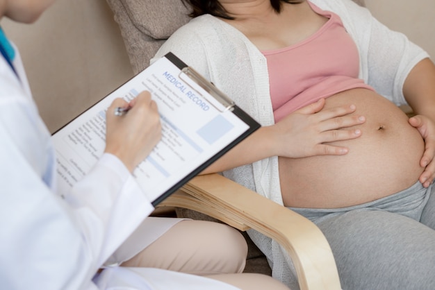 Pregnant Woman and Gynecologist Doctor at Hospital