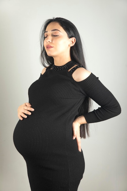 Pregnant woman hand on the belly