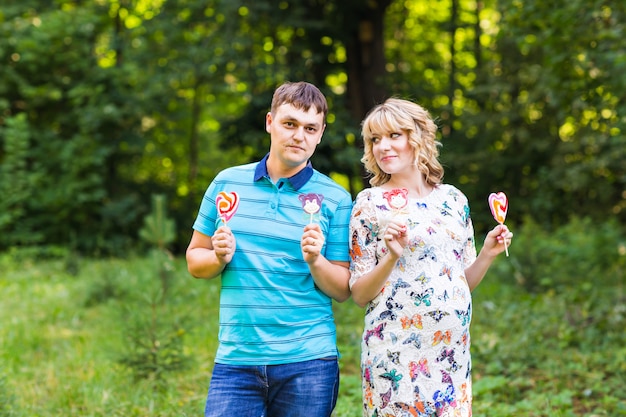 Pregnant woman and her husband outdoors