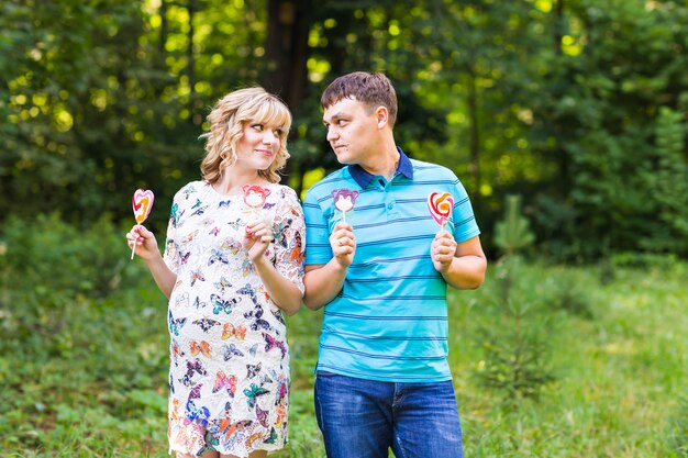 Pregnant woman and her husband outdoors